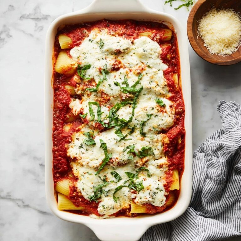 Creamy Baked Manicotti with Ricotta, Mozzarella, and Basil Recipe